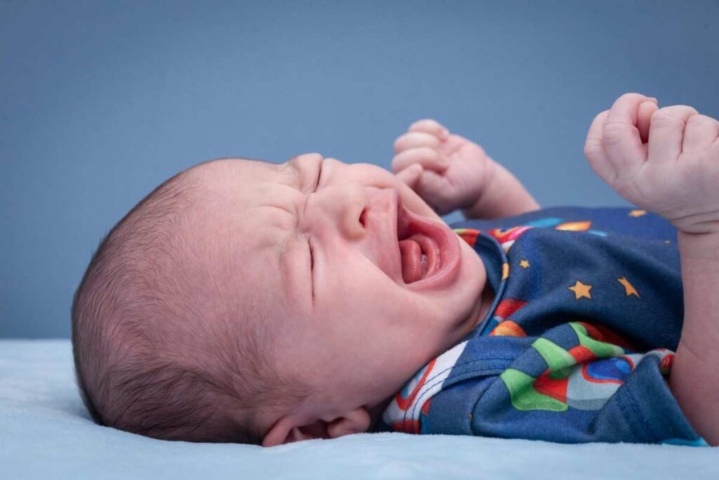 why do babies cry in their sleep